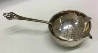 A silver tea strainer on stand. Birmingham 1961. By JB Chatterley and Sons Ltd. Approx. 80 grams.