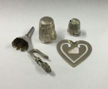 A small silver napkin clip with engraved decoratio