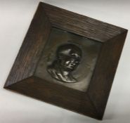 An old rectangular Pickwick figure in oak frame. E