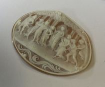 A large oval cameo of figures beneath trees. Appro