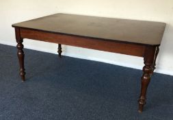 A Victorian mahogany rectangular dining table. Est