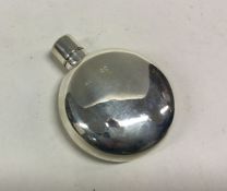 A Victorian silver flask of circular form. London 1882. By Sampson Mordan and Co. Approx. 34