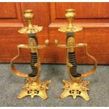 A pair of unusual candlesticks in the form of dressl