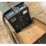 An old cased camera. Est. £20 - £30.