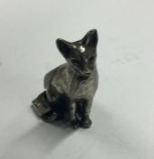 A silver figure of a cat. Marked to tail. Approx. 12 grams. Est. £20 - £30.