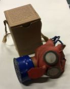 A child's wartime gas mask in original box, known