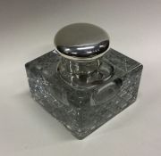 A silver mounted glass inkwell. Birmingham 1906. Est. £60 - £80.
