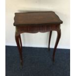 A Victorian shape top table with brass mounts. Est