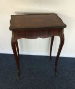 A Victorian shape top table with brass mounts. Est