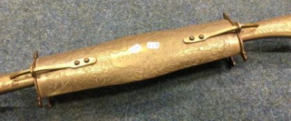 A souvenir brass double knife in travelling case.