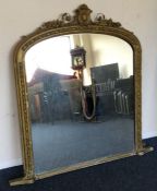 A large gild over mantle mirror. Est. £50 - £80.