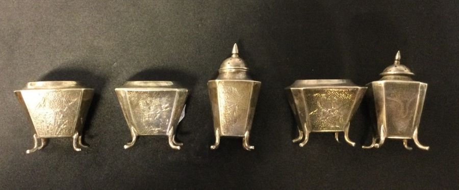A Chinese five piece hammered silver bamboo design condiment set. Marked WK to base. Circa 1900.