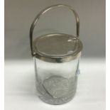 A silver mounted glass jar. Birmingham 1911. By Henry Matthews. Est. £15 - £20.