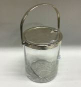 A silver mounted glass jar. Birmingham 1911. By Henry Matthews. Est. £15 - £20.