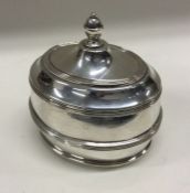 A silver tea caddy of oval form. Marked to base. Approx. 249 grams. Est. £180 - £220.