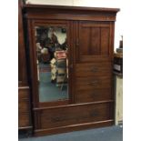 An Edwardian mahogany compactum wardrobe. Est. £60