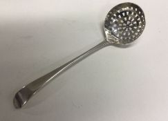 An old silver sifting spoon. London1796. Approx. 36 grams. Est. £30 - £50.