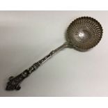 A heavy 19th Century French decorative figural silver sifter spoon. Approx. 67 grams. Est. £100 - £