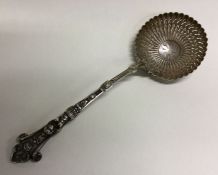 A heavy 19th Century French decorative figural silver sifter spoon. Approx. 67 grams. Est. £100 - £