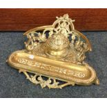 A heavy Victorian brass inkstand with pierced gall