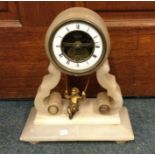A hardstone mantle clock with brass and enamelled