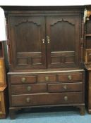 A Georgian oak four drawer housemaids cupboard. Es