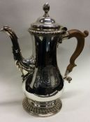 A George III silver crested coffee pot. London 1764. Approx. 918 grams. Est. £1200 - £1500.