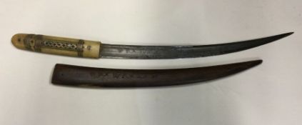 A heavy Antique knife with carved horn handle in s