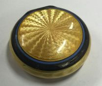 ASPREY & CO: A yellow and blue enamel pill box. Approx. 38 grams. Est. £120 - £150.