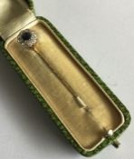 A good sapphire and diamond stick pin mounted as a