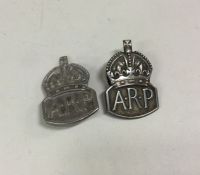 OF ROYAL INTEREST: A rare matched pair of silver badges. Approx. 19 grams. Est. £50 - £80.