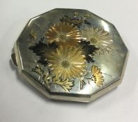 A finely engraved mixed metal Japanese compact. Approx. 97 grams. Est. £150 - £180.