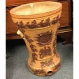 A large old earthenware water urn with crested dec