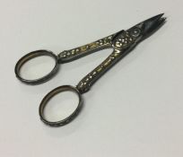 A good pair of early silver scissors. Approx. 19 grams. Est. £80 - £120.