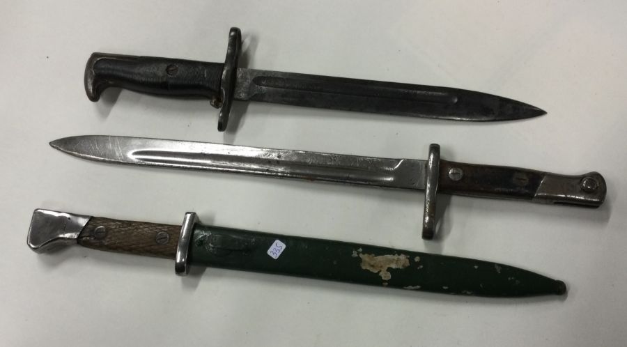 Three good bayonets with reeded handles. Est. £20