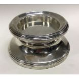 A heavy Millenium silver bottle coaster. Birmingham 2000. By B&Co. Approx. 453 grams. Est. £80 - £