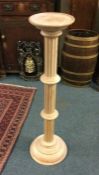 A satinwood pedestal. Est. £10 - £20.