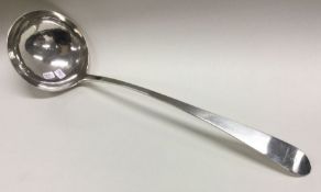 DUBLIN: A George III silver soup ladle with creste