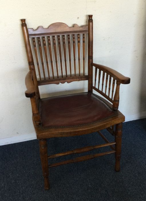 A cane back hall chair. Est. £20 - £30.