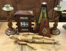 An old metronome, candlesticks etc. Est. £10 - £20