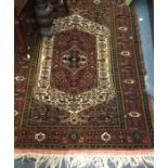 An old rug. Approx. 131cms x 175cms. Est. £40 - £5