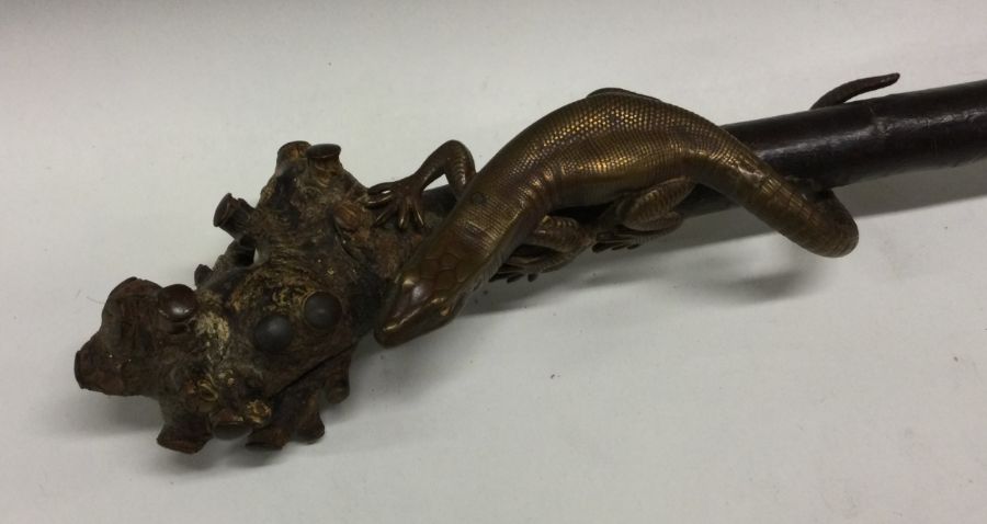 An Antique rootwood bell decorated with a lizard. - Image 2 of 2