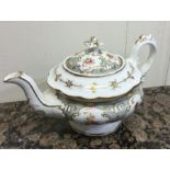 An attractive porcelain teapot decorated with flow