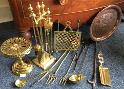 A copper and brass companion set. Est. £20 - £30.