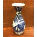 A Chinese blue and white vase with shaped rim. Est