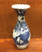 A Chinese blue and white vase with shaped rim. Est