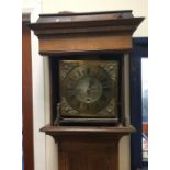 Am oak cased Grandfather clock with brass dial. Es