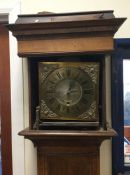 Am oak cased Grandfather clock with brass dial. Es