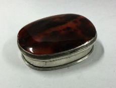 An Antique oval agate snuff box with silver mounts