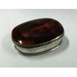 An Antique oval agate snuff box with silver mounts